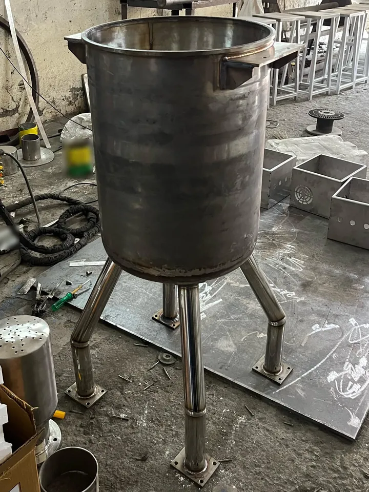 Food-grade stainless steel mixing tank on four legs, sourced for a client in Benin