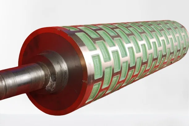 Rotary moulder die roll with green plastic inserts engraved with the biscuit design
